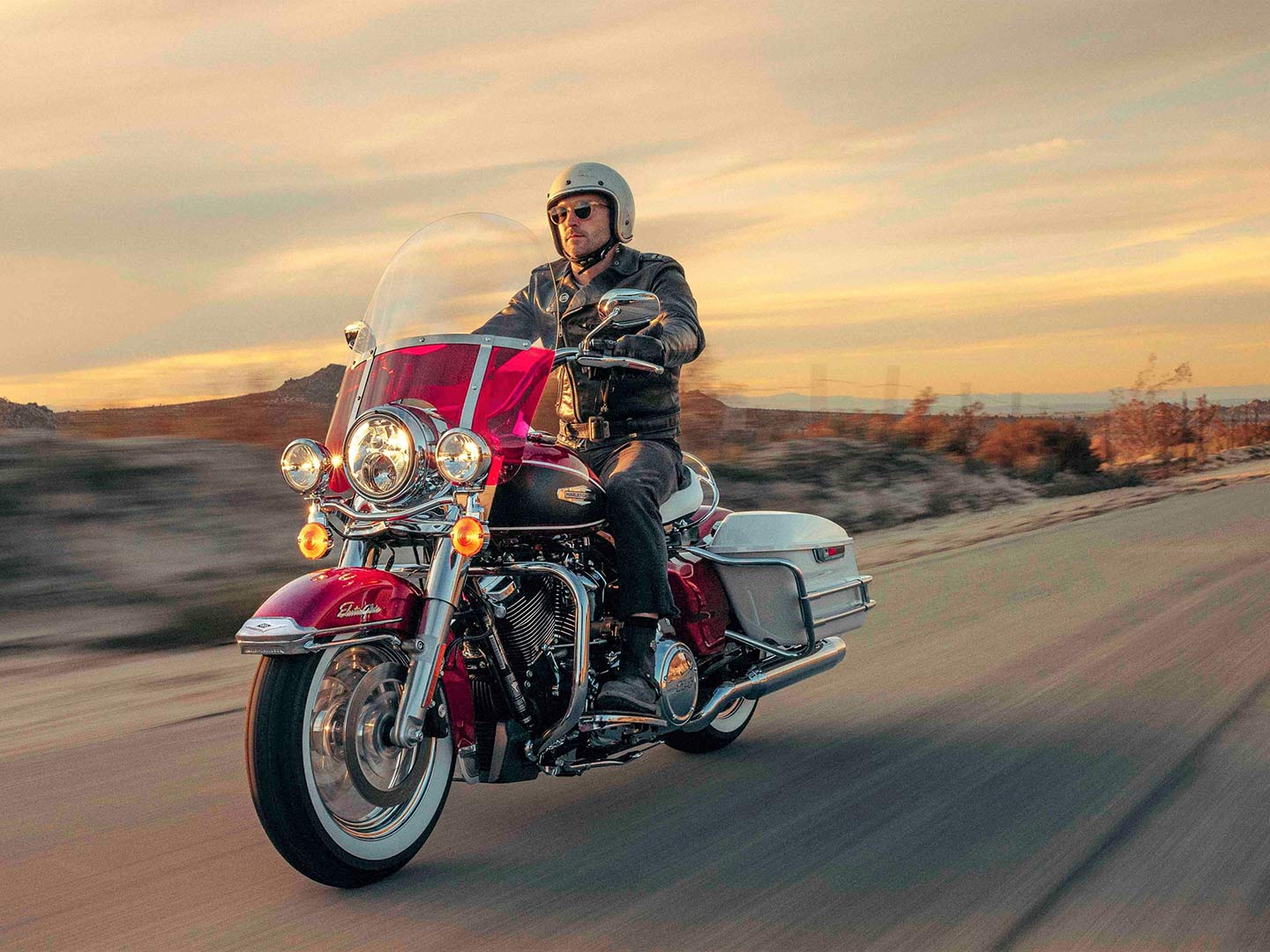Rider cruising on a Harley-Davidson Electra Glide Highway King.