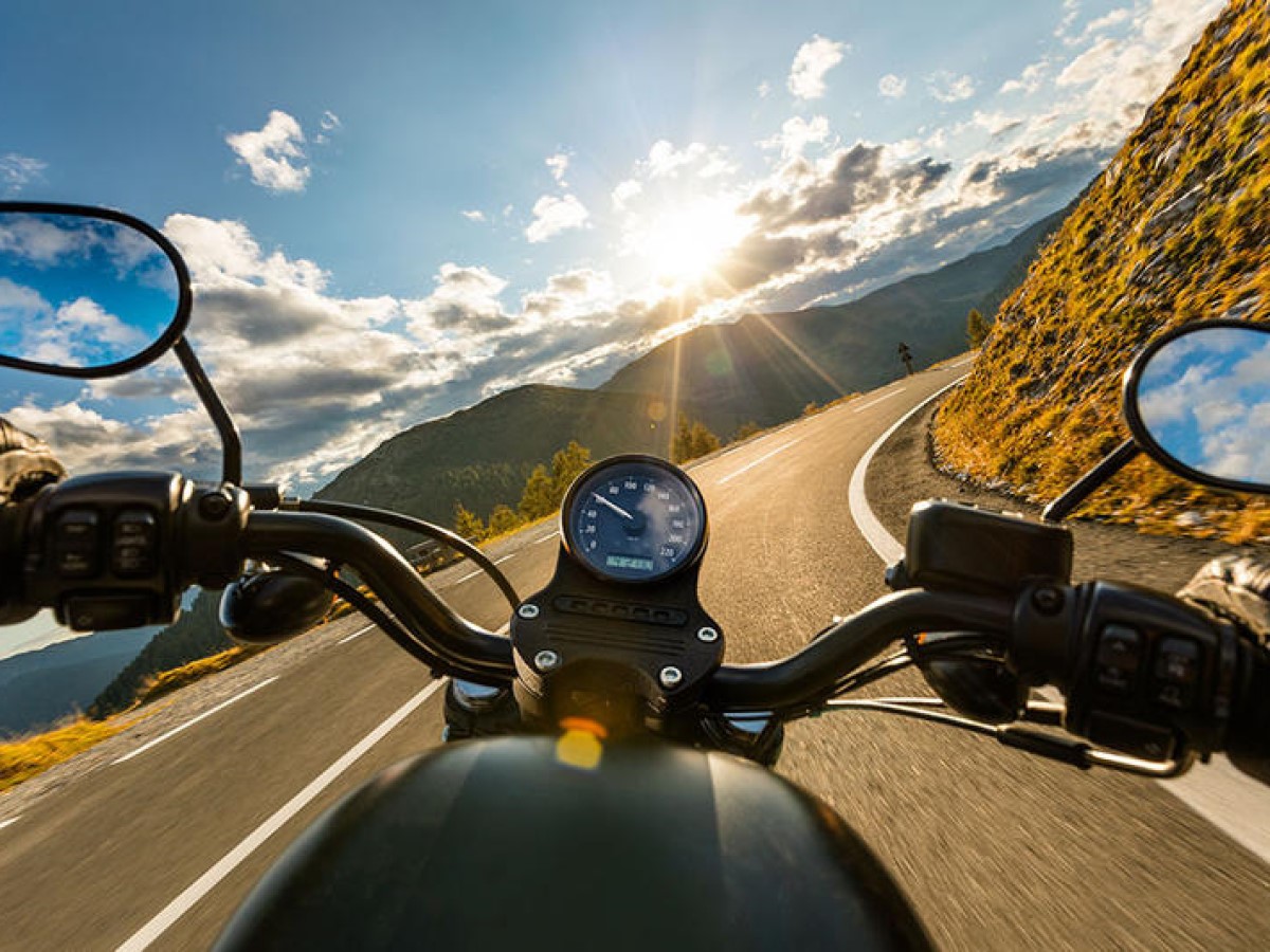 POV of open road on a Harley-Davidson